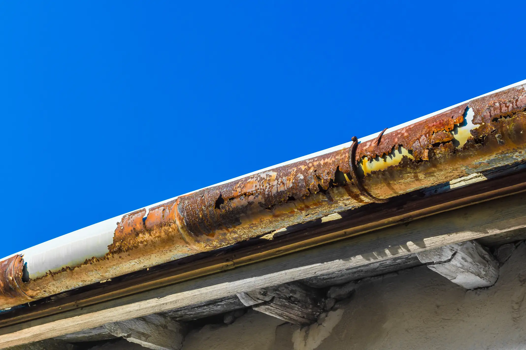 Rusted gutter needing urgent gutter repair.